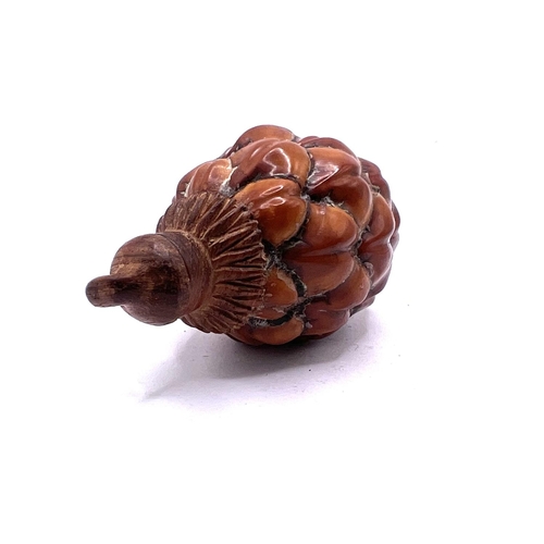 68 - A Chinese pinecone repurposed for use a a snuff bottle. 7.5cm