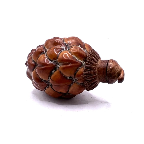 68 - A Chinese pinecone repurposed for use a a snuff bottle. 7.5cm