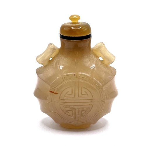 70 - A weave hardstone bottle in a flared lantern design carved to either side is the Chinese auspicious ... 