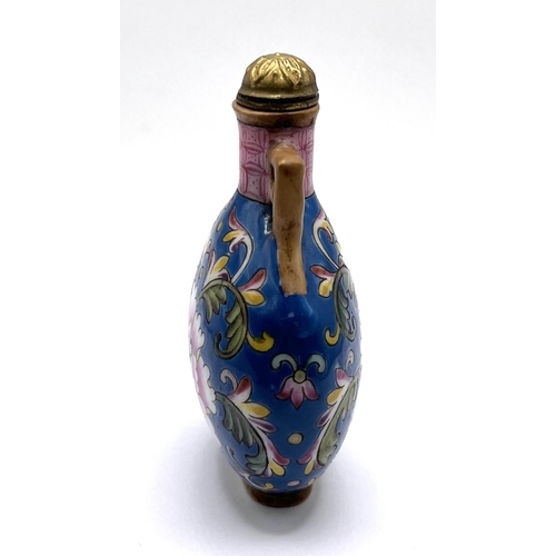 71 - A fine hand painted famille rose porcelain snuff bottle with floral design. 7.5cm.