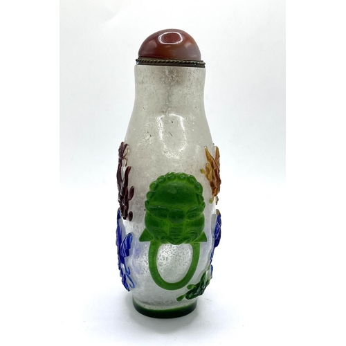 75 - A large hand carved cameo glass snuff bottle with multicoloured glass overlay. 11cm.