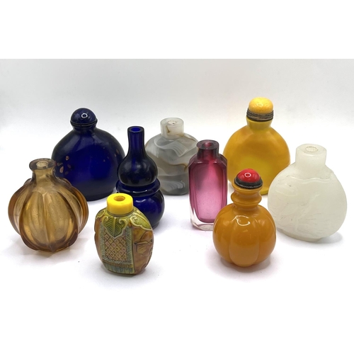 82 - A group lot of Chinese snuff bottles all moulded from glass, various designs. (9)