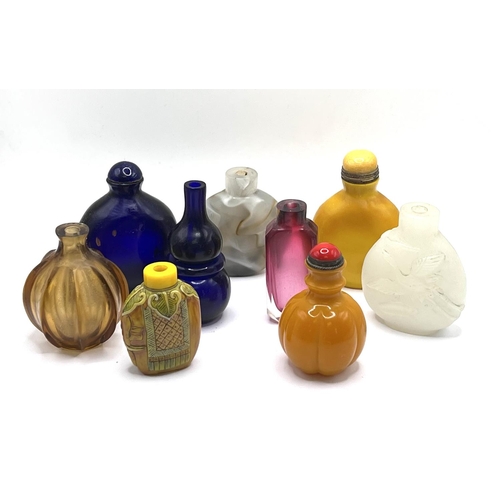 82 - A group lot of Chinese snuff bottles all moulded from glass, various designs. (9)