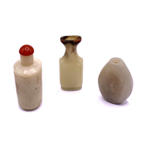 84 - 3 small carved jadeite snuff bottles. 5cm.