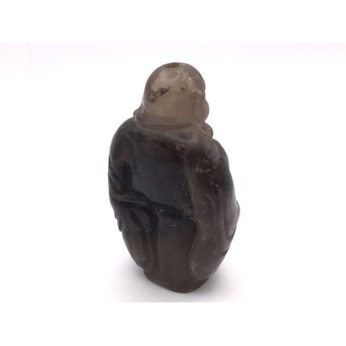 9 - A carved Rock crystal snuff bottle in the form of The Laughing Buddha, 9cm.