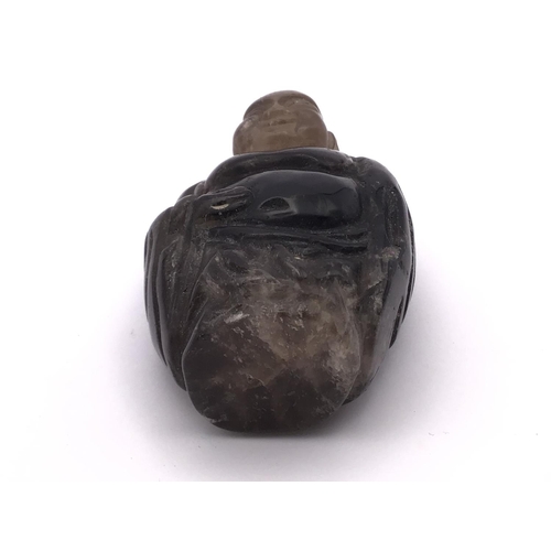 9 - A carved Rock crystal snuff bottle in the form of The Laughing Buddha, 9cm.