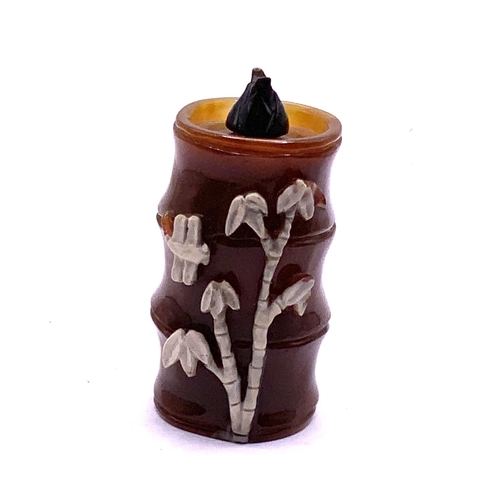 91 - A carved agate snuff bottle in the from of a bamboo shoot. 6cm.