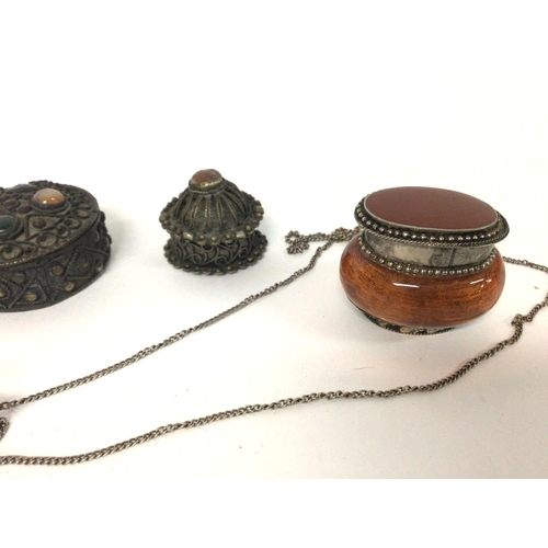 1352 - Three decorated pin boxes, two similar scent bottles and an unusual small metal and glass lidded box... 