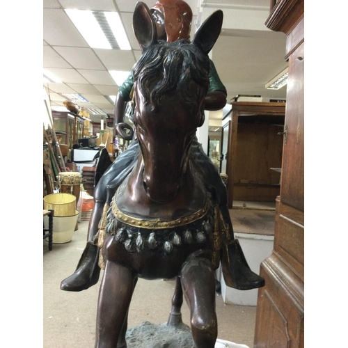 1362 - A large and impressive bronze in the form of a eastern figure on horse back .58 x 37 cm approximatel... 