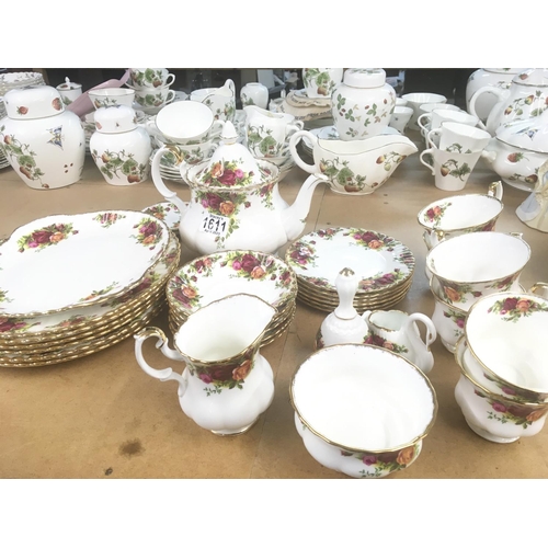 1611 - A Royal Albert old English country rose tea set and dinner plate set six place setting and tea pot.