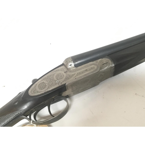 2149 - A 12bore double barrel side by side shot gun Maker Denton and Kennell with a nice engraved steel act... 