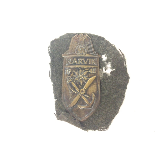 2155 - WW2 German Narvik Shield cut from a uniform. Postage cat a