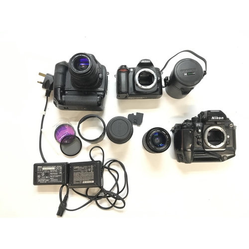 2481 - A collection of cameras and lenses. Postage C