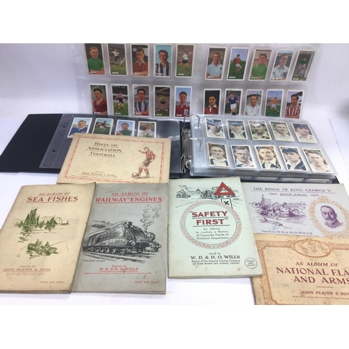 2486 - A box of various cigarette card albums. Various subjects including football, speedway and others. Sh... 