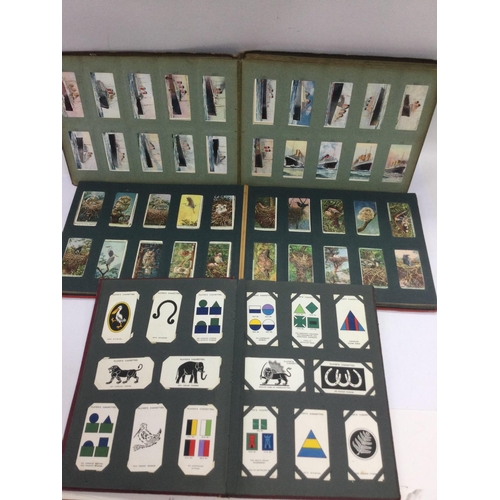 2486 - A box of various cigarette card albums. Various subjects including football, speedway and others. Sh... 