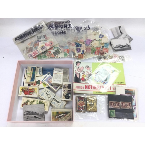 2487 - A box of various ephemera including postcards, stamps, coins etc. Shipping category D.