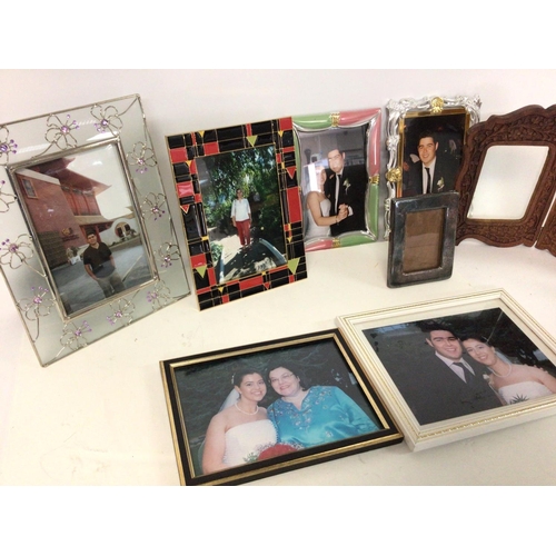 2490 - A collection of photograph frames. Postage cat D