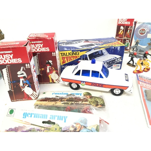 998 - A Collection of Boxed Busy Bodies. A Talking Palitoy Police Car. Plastic Toy soldiers etc.