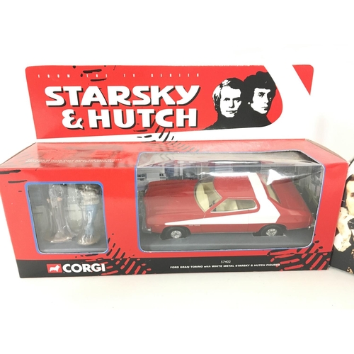 102 - A Boxed Corgi Starsky and Hutch Ford Gran Torino and a Faulty Towers Mini.