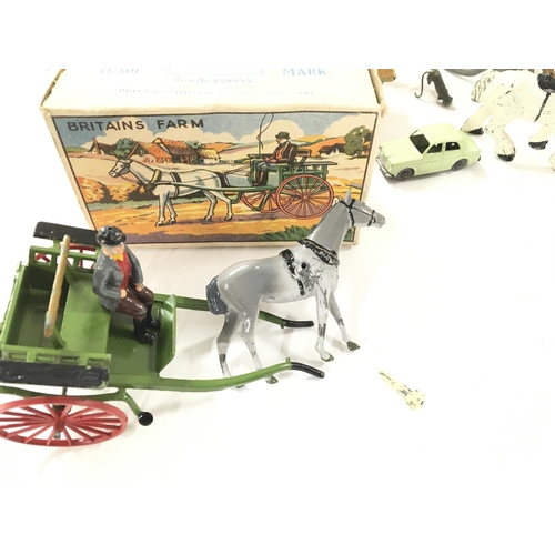 105 - A Collection of Dinky Toys and Britainâs Farm Animals.