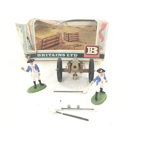 149 - A Boxed Britains Gun of the Revolution #9737. Box is worn.