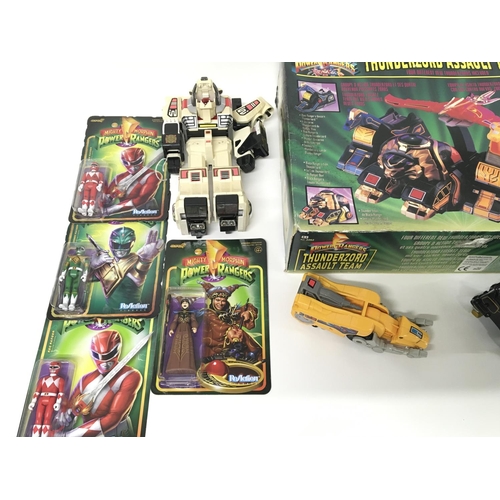 162 - A collection of power ranger items including an original Thunderzord.