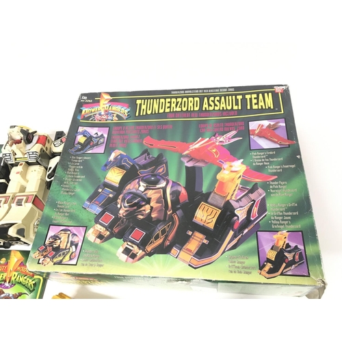 162 - A collection of power ranger items including an original Thunderzord.