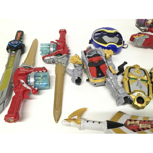 164 - A large collection of assorted power Ranger items.