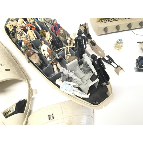 165 - A collection of vintage Star Wars items including rebel transport and figures etc.