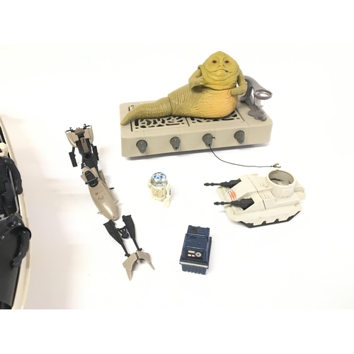 165 - A collection of vintage Star Wars items including rebel transport and figures etc.