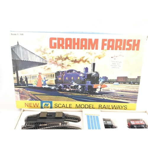 177 - A Tri-ang battle rescue helicopter car and a N gauge Graham Farish train set.