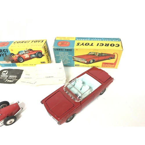 209 - A Boxed Corgi Lotus Elan S2 #318. A Ferrari Formula 1 Car #154 and a Chrysler Imperial #246.