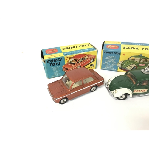 210 - A Boxed Corgi Hillman IMP #251. A Volkswagen European Police Car #492 and. police Panda IMP #506.