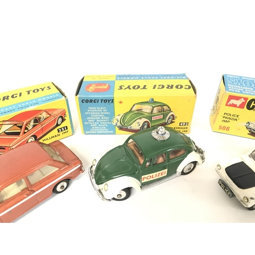 210 - A Boxed Corgi Hillman IMP #251. A Volkswagen European Police Car #492 and. police Panda IMP #506.