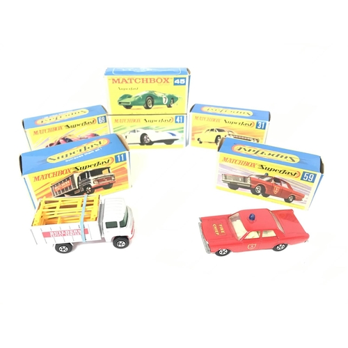 216 - A Collection of 6 Boxed Matchbox Superfast Vehicles and a Hay Trailer.