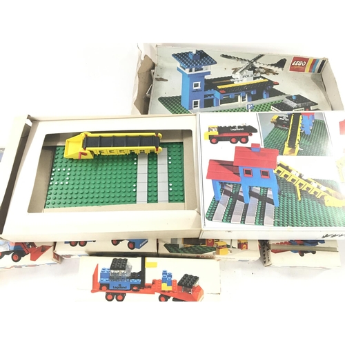 221 - A Collection of Boxed Lego Including Lorrys. Aircraft. Etc. (Parts Missing).