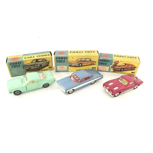 33 - 3 X Boxed Corgi Vehicles including a Ford Mustang #320. A Oldsmobile #235 and a Chevrolet Corvette S... 