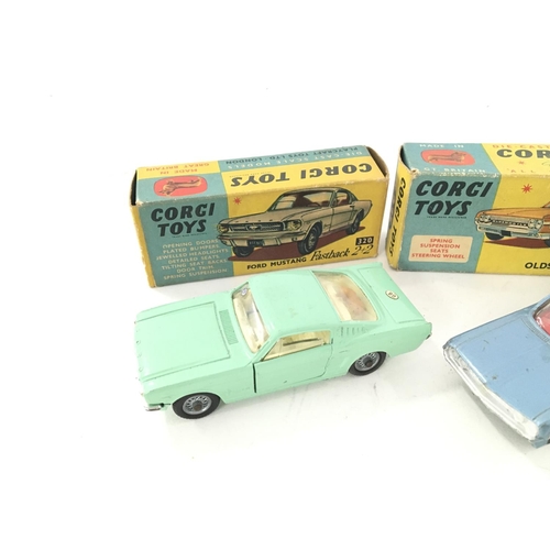 33 - 3 X Boxed Corgi Vehicles including a Ford Mustang #320. A Oldsmobile #235 and a Chevrolet Corvette S... 
