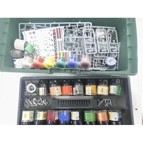 335 - A case Containing War Hammer Vehicles and Figures also some paints.