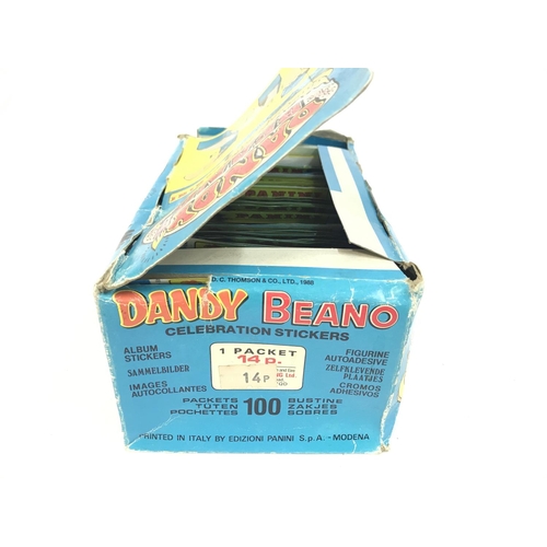 375 - A Panini Trade Box Containing Dandy Beano Celebration Stickers. Still in Packets. Some packets have ... 