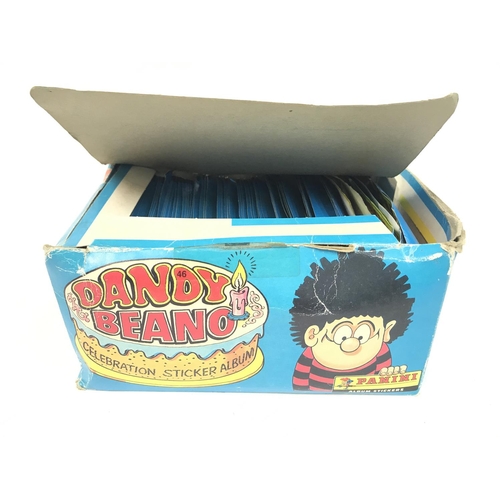 375 - A Panini Trade Box Containing Dandy Beano Celebration Stickers. Still in Packets. Some packets have ... 