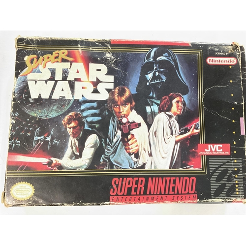 437 - A Boxed Star Wars R2-D2 Telephone and a Super Nintendo Super Star Wars Game.(2)