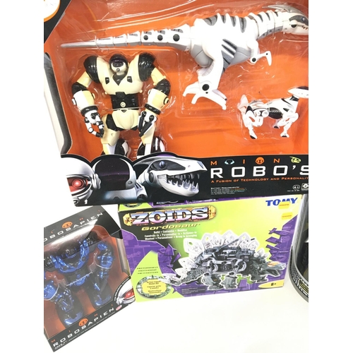 496 - A Box Containing Robosapien Robots. A Zoid and a Teksta Robo Dog.