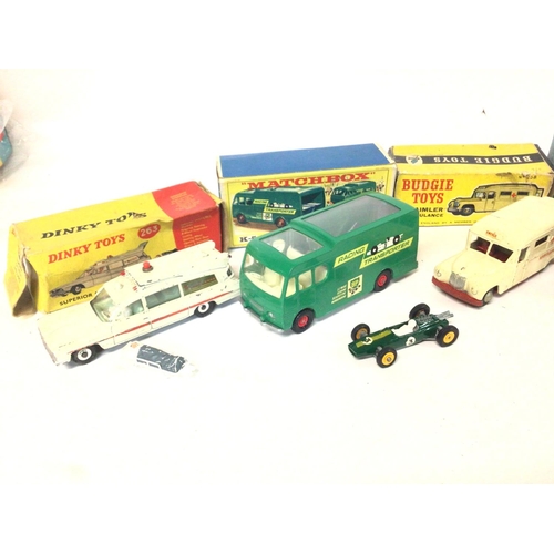 546 - 4 Boxed Vehicles including Dinky Ambulance #263. A Matchbox Racing-Car Transporter #K-9. A Budgie To... 