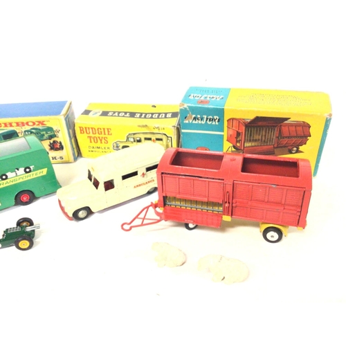 546 - 4 Boxed Vehicles including Dinky Ambulance #263. A Matchbox Racing-Car Transporter #K-9. A Budgie To... 