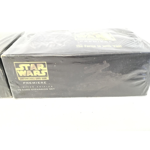 562 - Two sealed Star Wars customisable card games, sealed