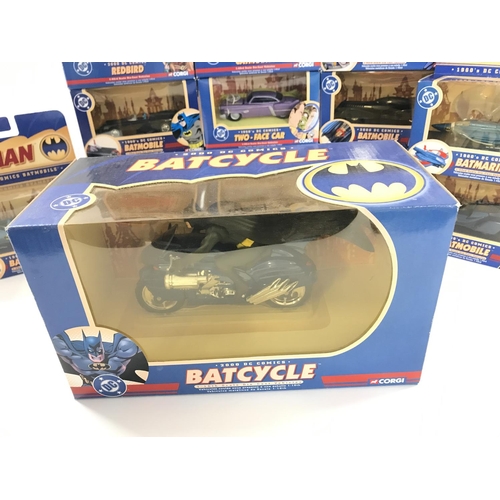65 - A Collection of Boxed Corgi Batman Vehicles including a Batcycle.