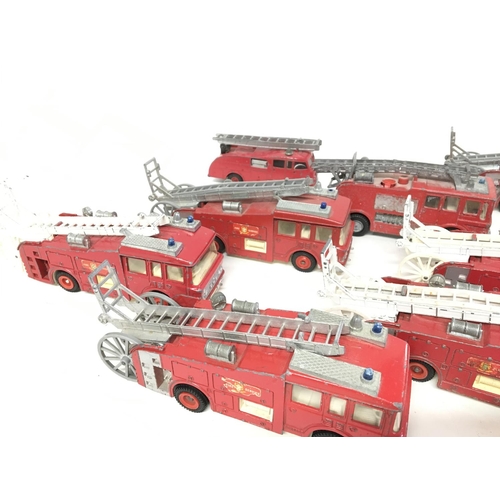 701 - A Collection of Playworn Dinky Fire Engines.