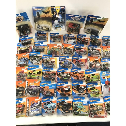 74 - A Box Containing a Large Collection of Carded Hotwheels and Matchbox Vehicles.