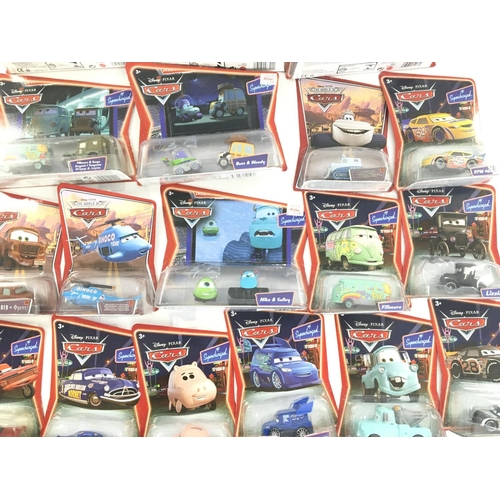 79 - A Large Collection of Pixar/Disney Carded Cars by Mattel.